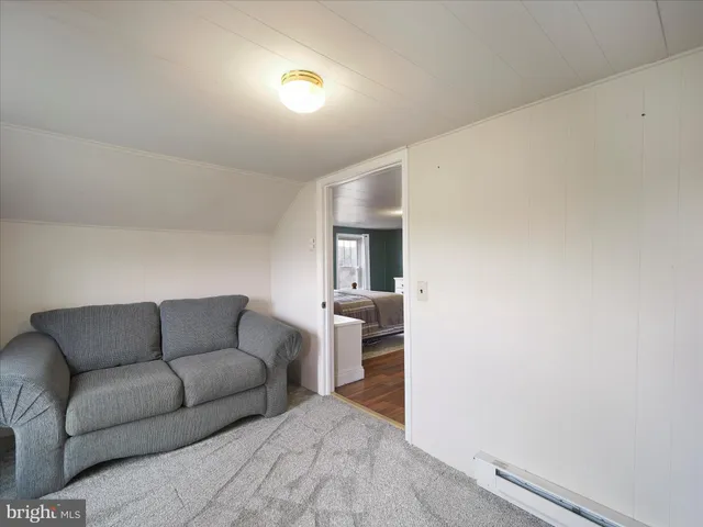 a view of empty room with wooden ceiling