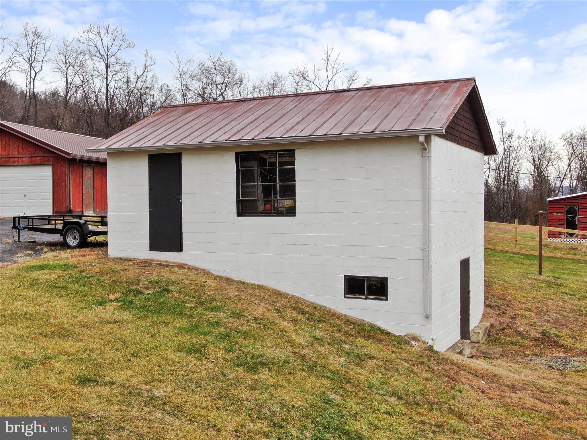 14628 Hollow Road Hancock, MD 21750 - Photo 42 of 54 a view of a house with a backyard