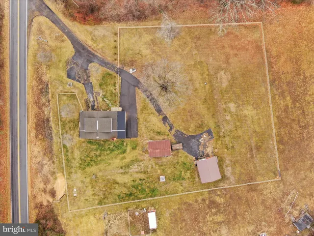 a view of a yard with mountains in the background