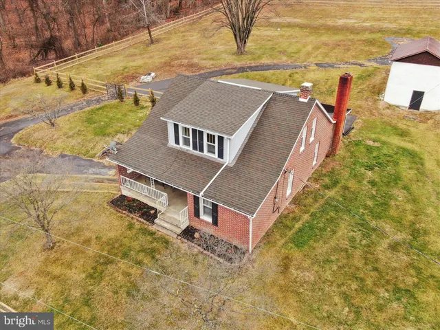 a aerial view of a house with a yard