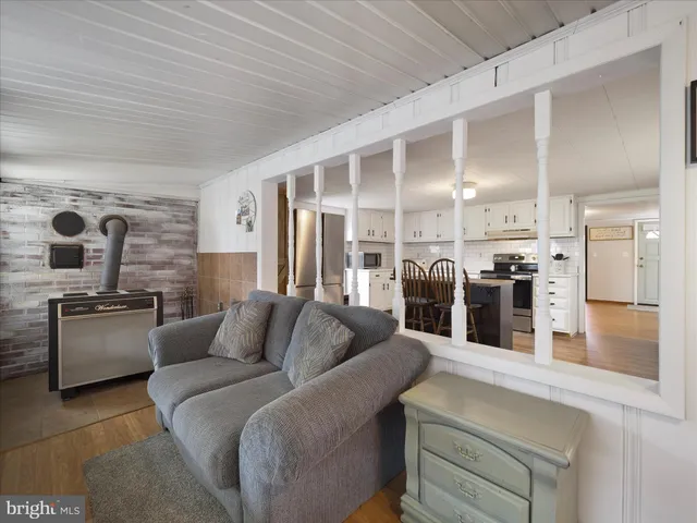 a living room with furniture and large windows