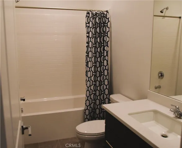 a bathroom with a sink a toilet and a bathtub