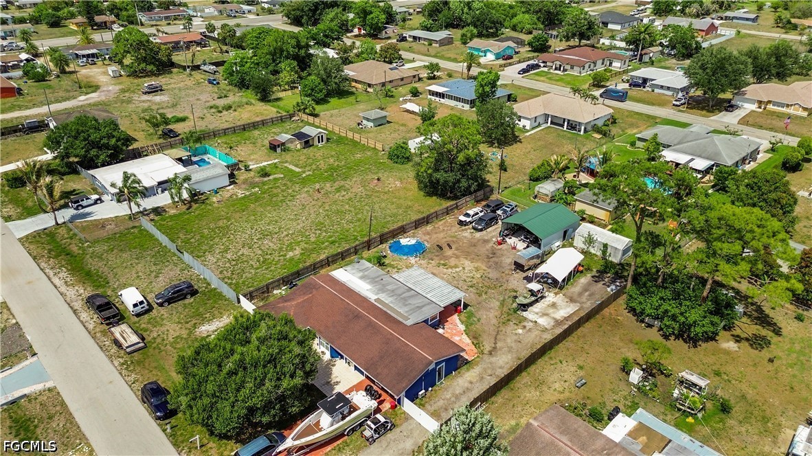 18 Illinois Road Lehigh Acres, FL 33936 - Photo 6 of 45 an aerial view of a residential houses with outdoor space