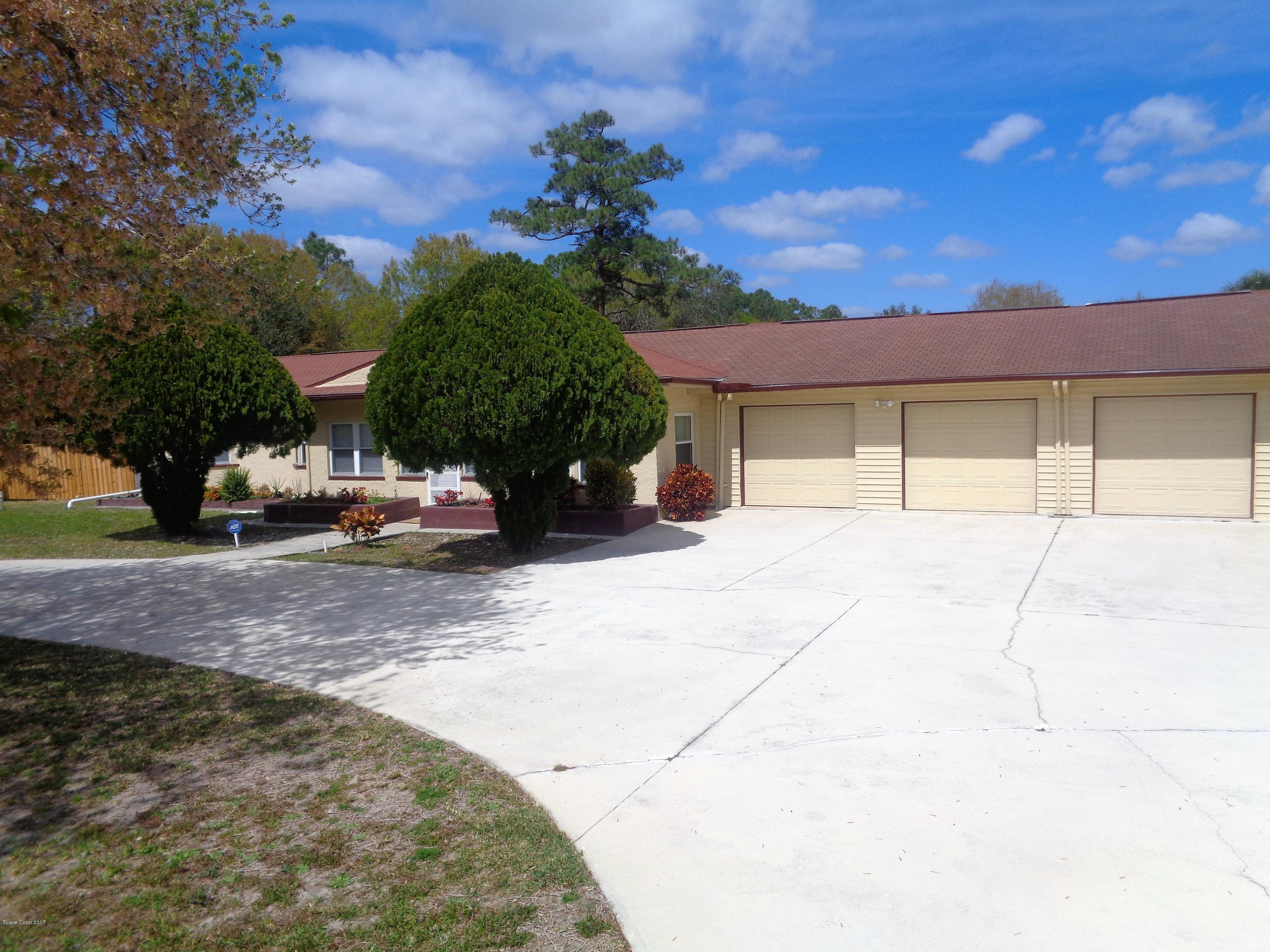 3630 Hield Road West Melbourne, FL 32904 - Photo 3 of 27 a house with a yard