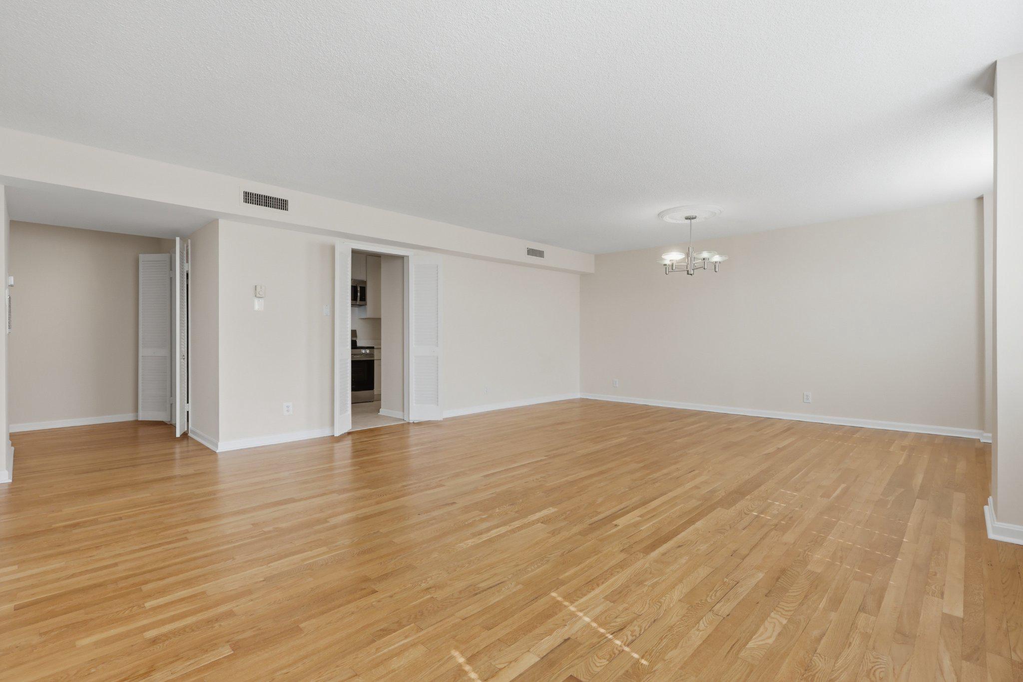 1101 St Paul Street, Unit 1212 Baltimore, MD 21202 - Photo 14 of 36 Spacious, sunlit open living/dining area.