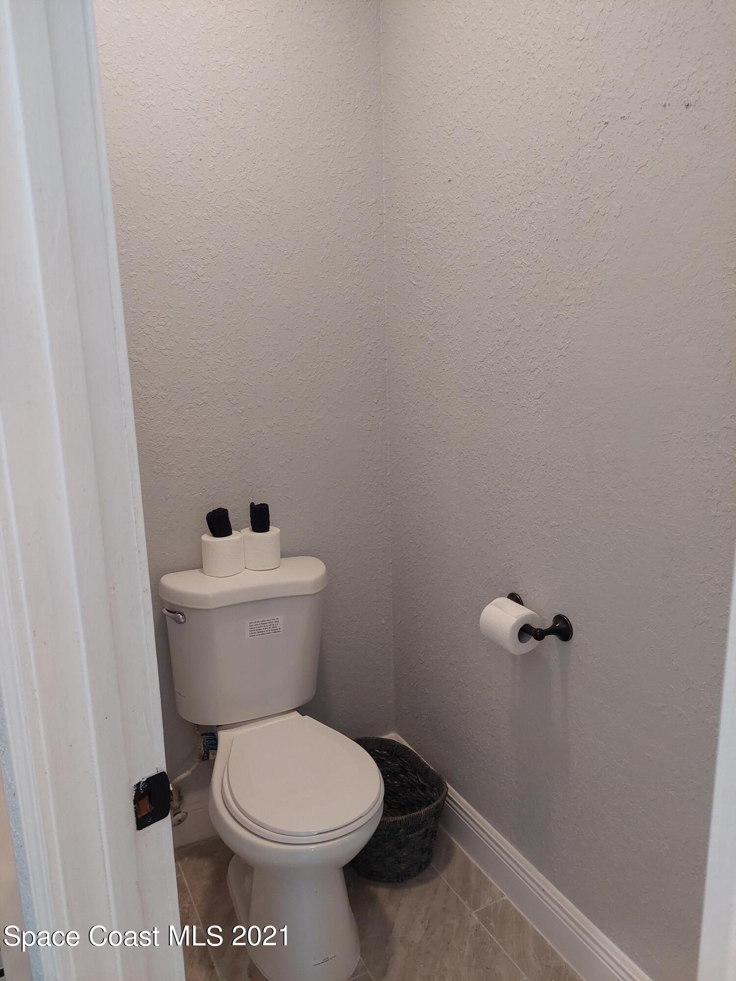 631 Furth Road Northwest Palm Bay, FL 32907 - Photo 19 of 42 a white toilet sitting next to a shower
