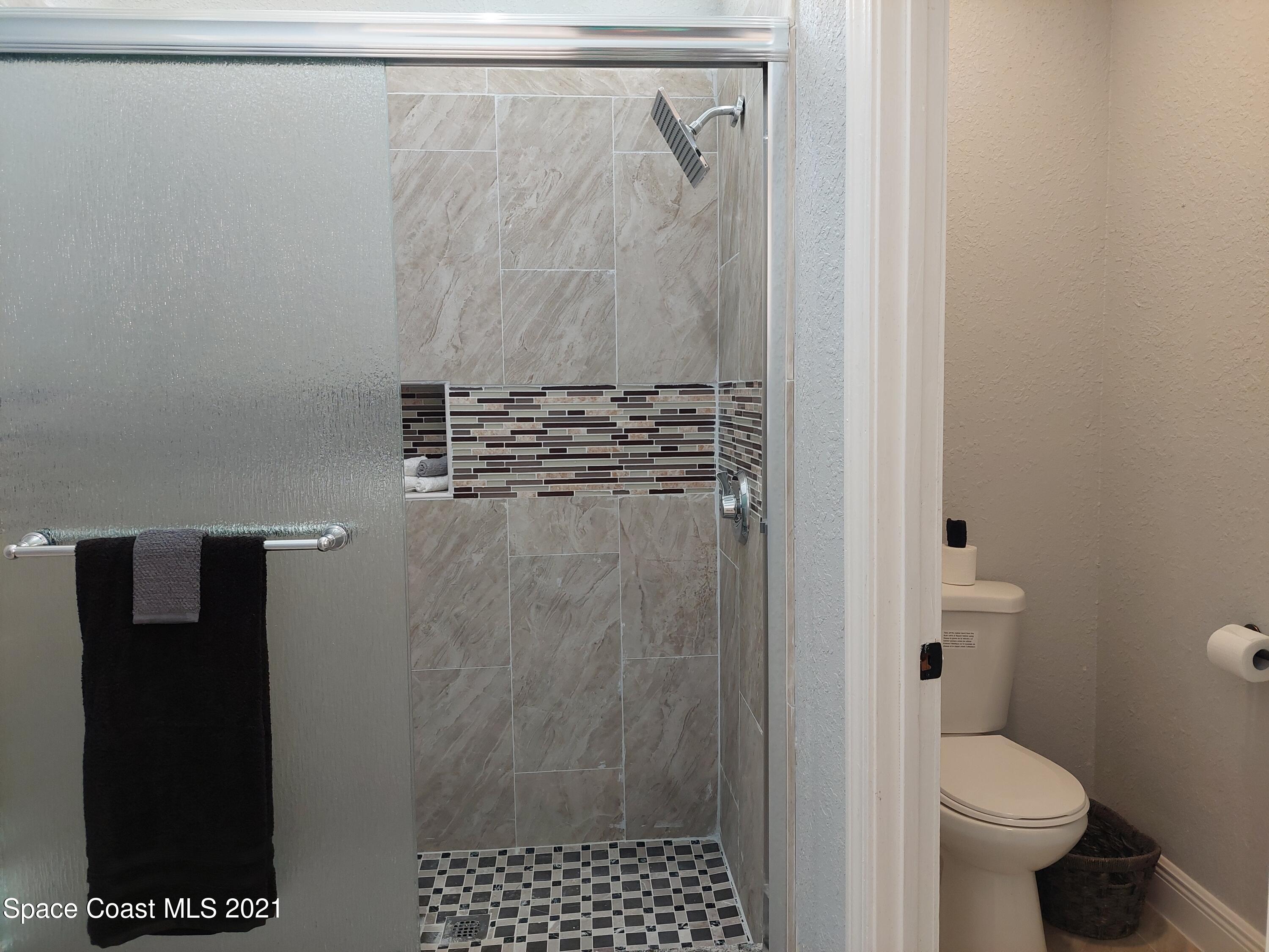 631 Furth Road Northwest Palm Bay, FL 32907 - Photo 20 of 42 a bathroom with a shower and a toilet