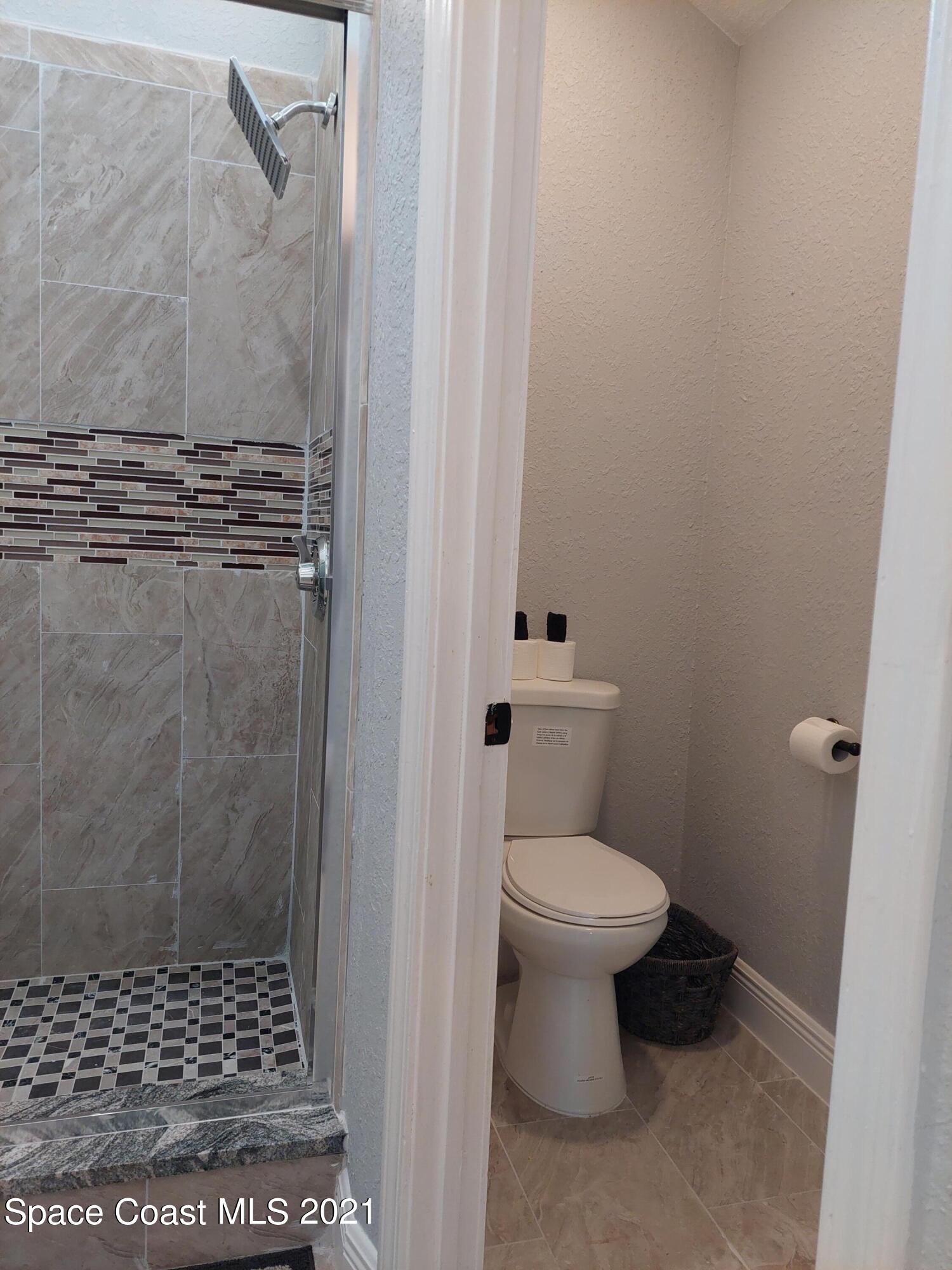 631 Furth Road Northwest Palm Bay, FL 32907 - Photo 21 of 42 a bathroom with a toilet and a shower