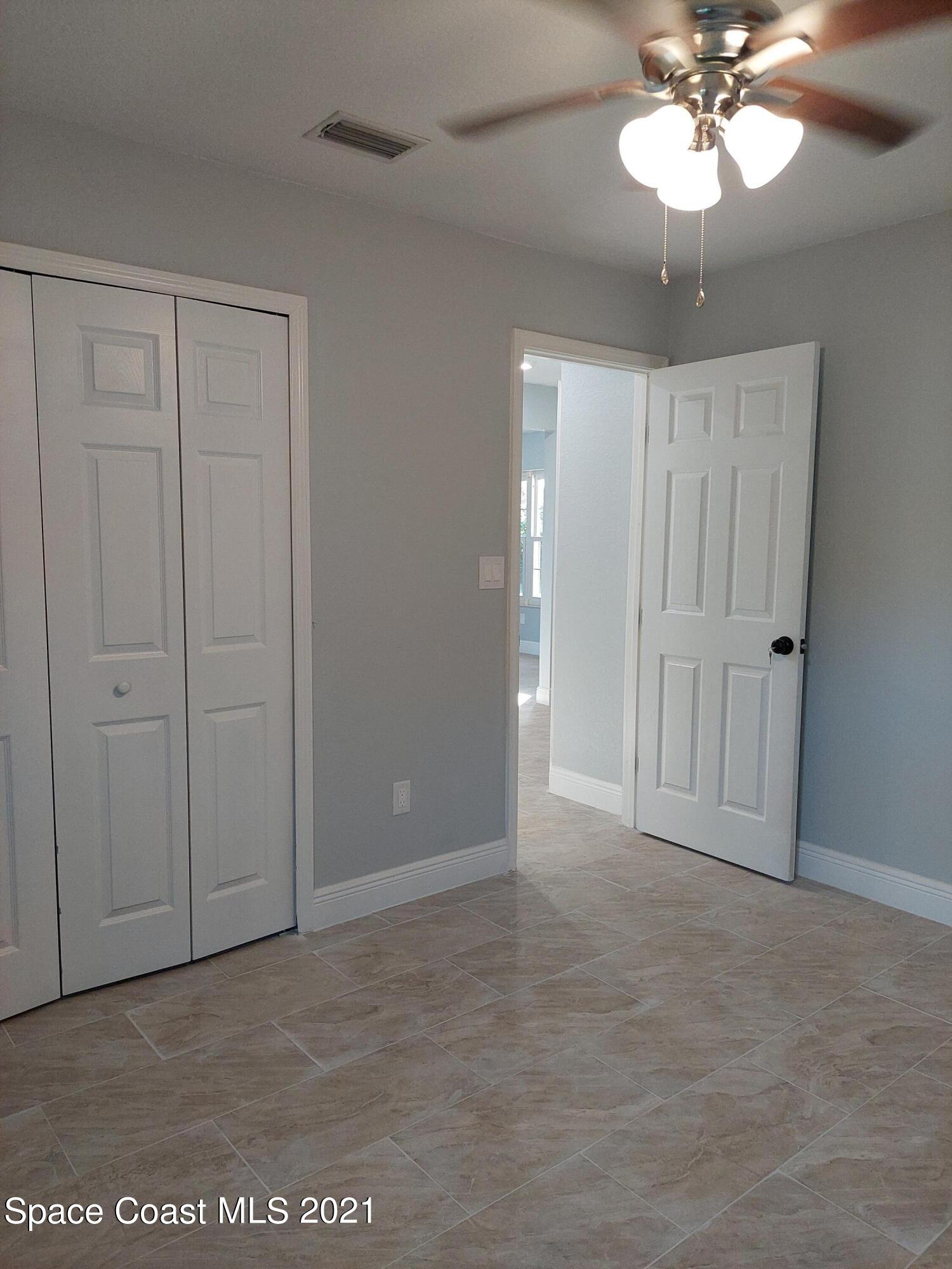 631 Furth Road Northwest Palm Bay, FL 32907 - Photo 27 of 42 a view of an empty room with a window