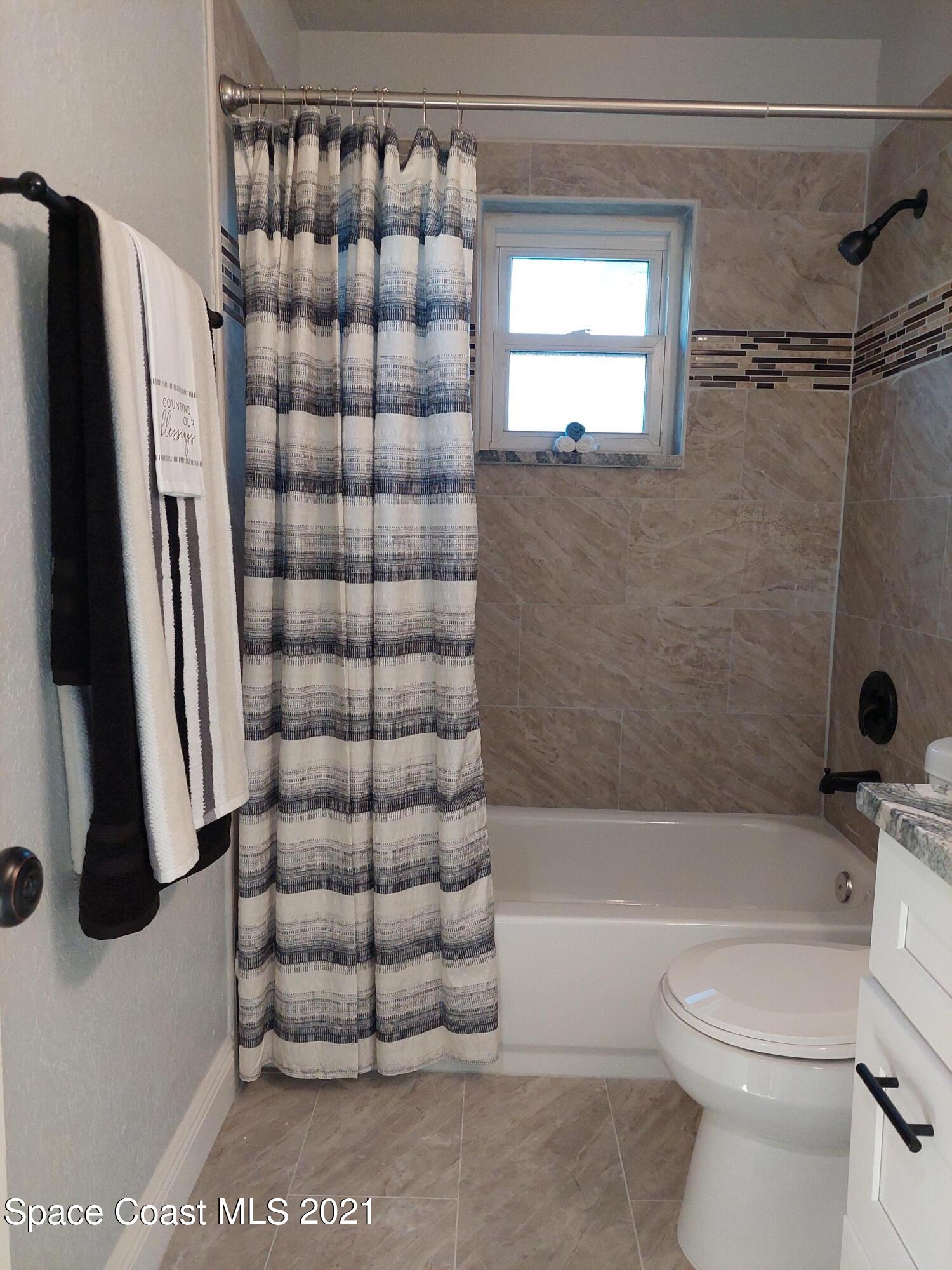 631 Furth Road Northwest Palm Bay, FL 32907 - Photo 31 of 42 a bathroom with a toilet and a shower