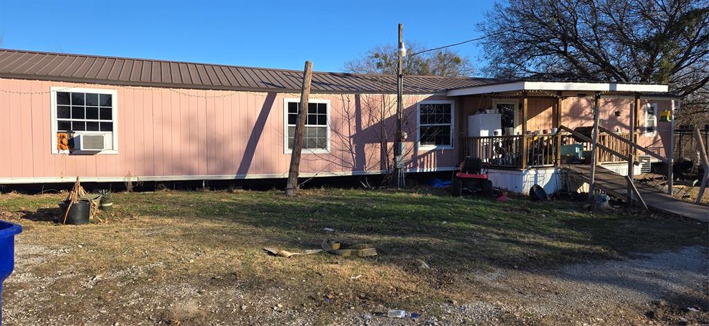 216 South Robinson Street Muenster, TX 76252 - Photo 3 of 5 a view of a house with a yard