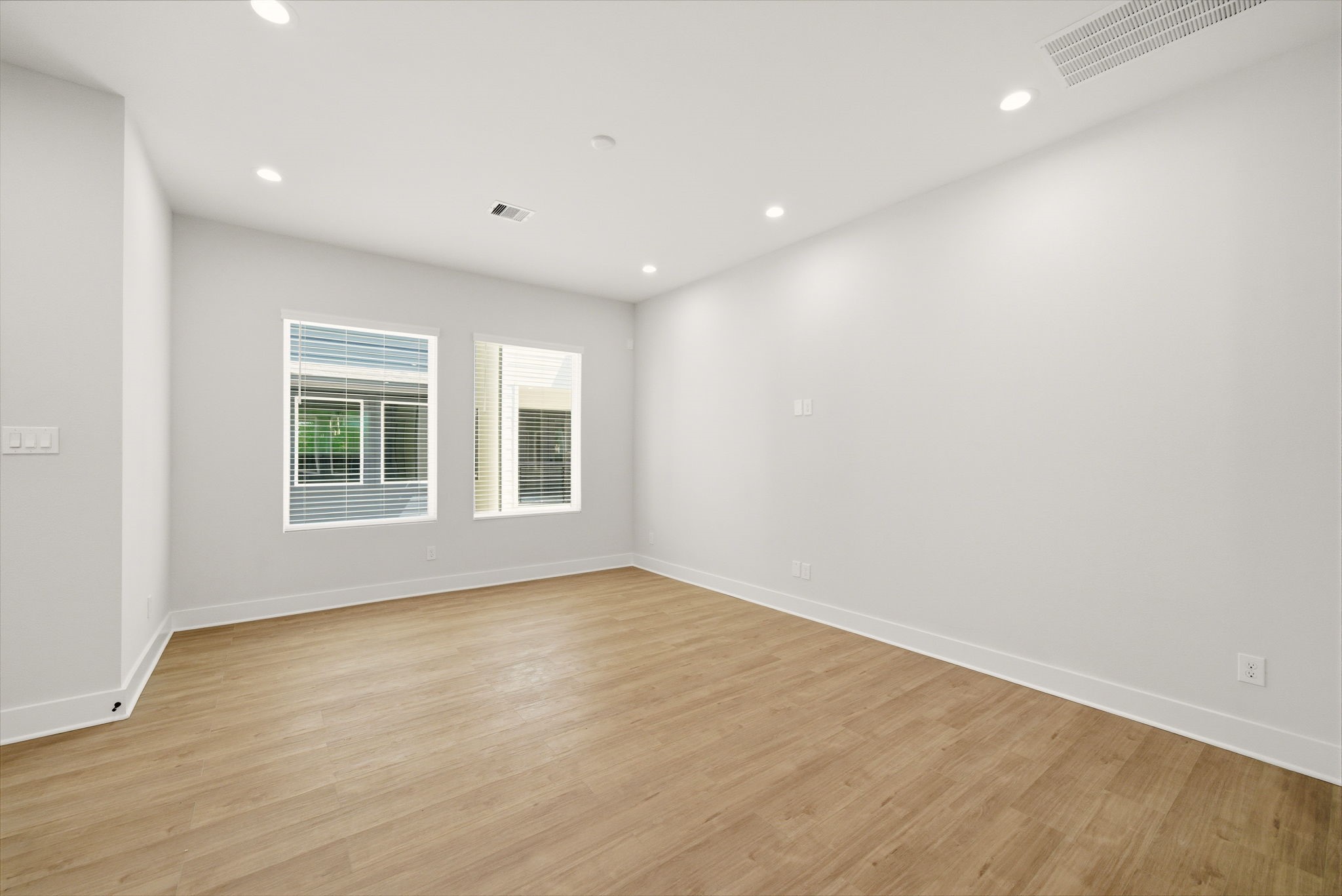 1398 Cedar Post Lane Houston, TX 77080 - Photo 16 of 33 a view of empty room with wooden floor and fan