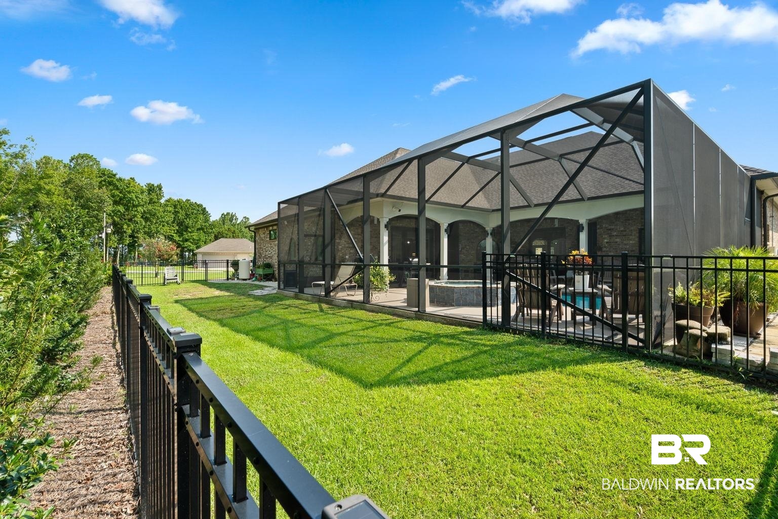 23357 Carnoustie Drive Foley, AL 36535 - Photo 90 of 99 Fenced backyard featuring glass enclosure and a patio