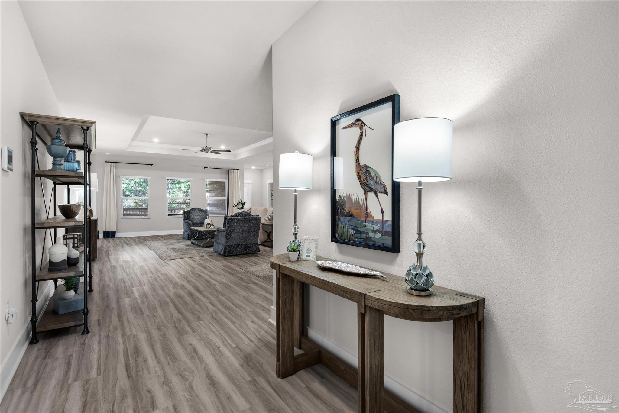 3468 Crossvine Road Cantonment, FL 32533 - Photo 14 of 45 a view of living room with furniture and wooden floor