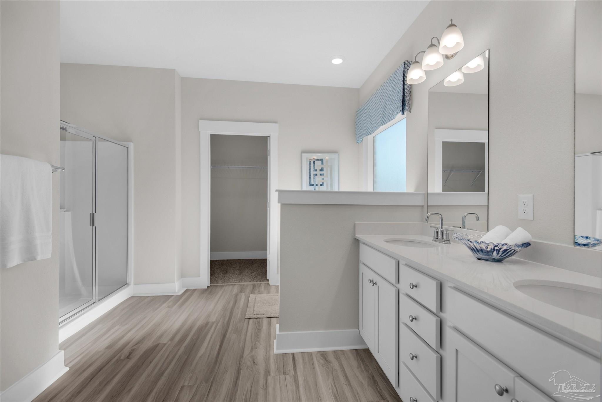 3468 Crossvine Road Cantonment, FL 32533 - Photo 34 of 45 a bathroom with a sink vanity and a mirror