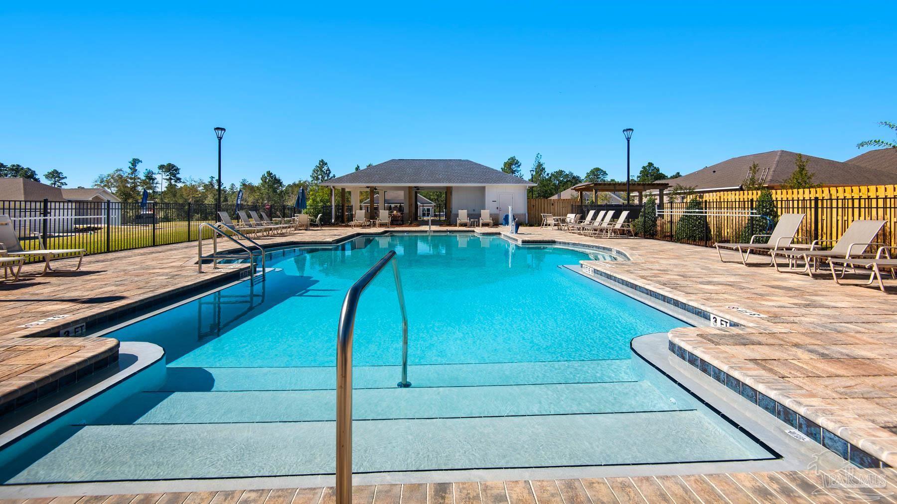 3468 Crossvine Road Cantonment, FL 32533 - Photo 45 of 45 a view of a swimming pool with seating space