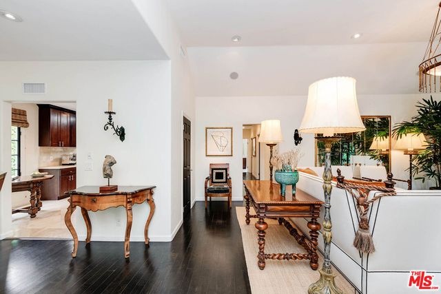a workspace with furniture window and wooden floor