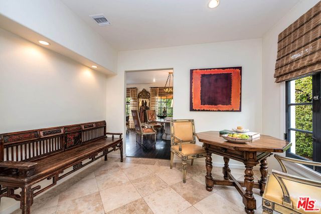 a reading room with furniture and a window