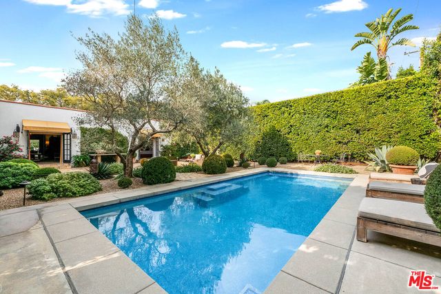 a view of a swimming pool with a patio