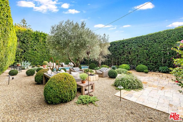 a view of a garden with patio