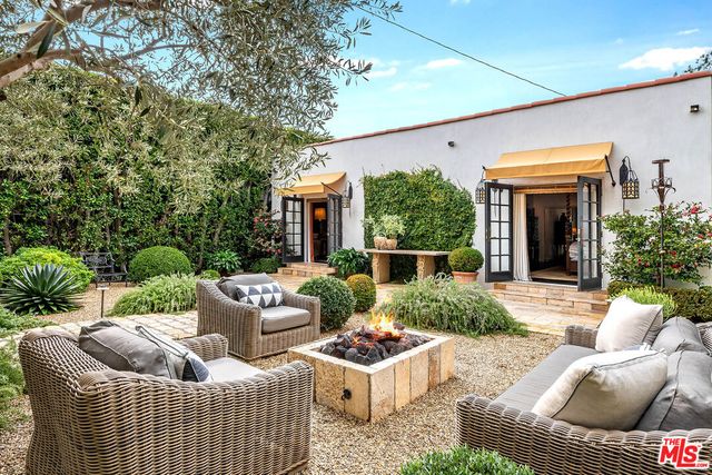 a view of house with patio outdoor seating
