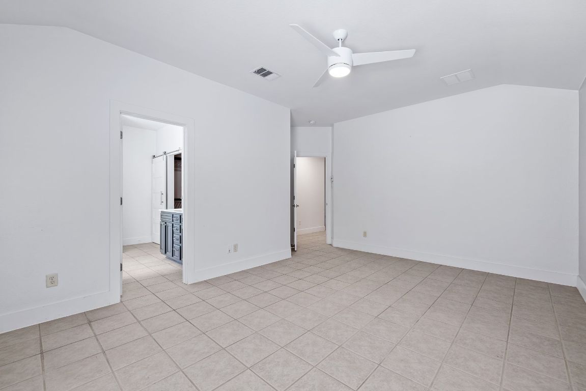 9324 Muskberry Cove Austin, TX 78717 - Photo 15 of 26 an empty room with fan and ceiling fan