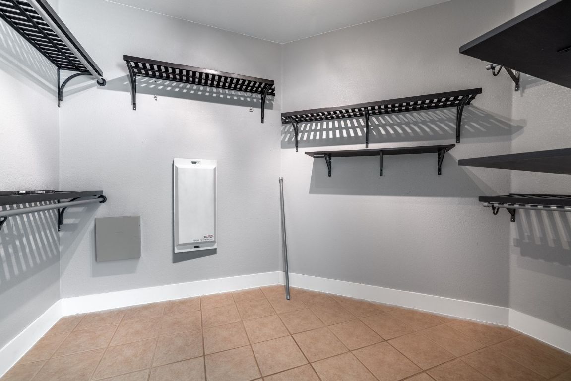 9324 Muskberry Cove Austin, TX 78717 - Photo 18 of 26 a view of a room with racks on the wall