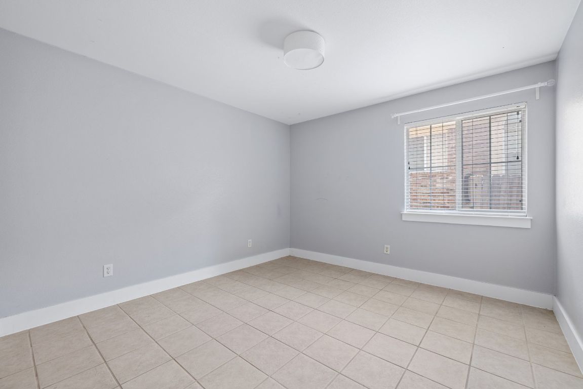 9324 Muskberry Cove Austin, TX 78717 - Photo 21 of 26 wooden floor in an empty room with a window