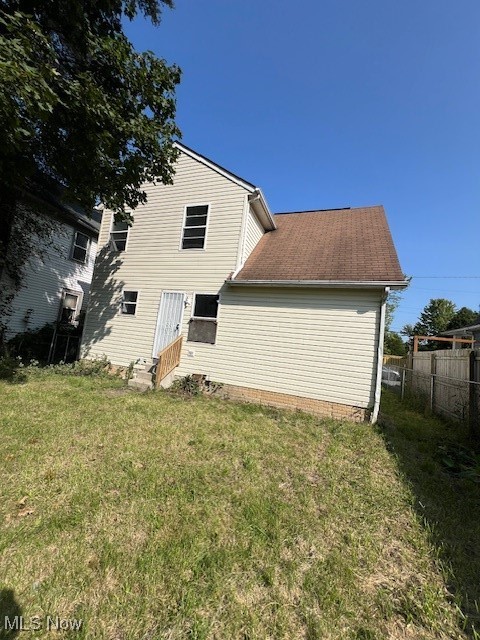10422 Reno Avenue Cleveland, OH 44105 - Photo 21 of 21 Rear view of property featuring a lawn