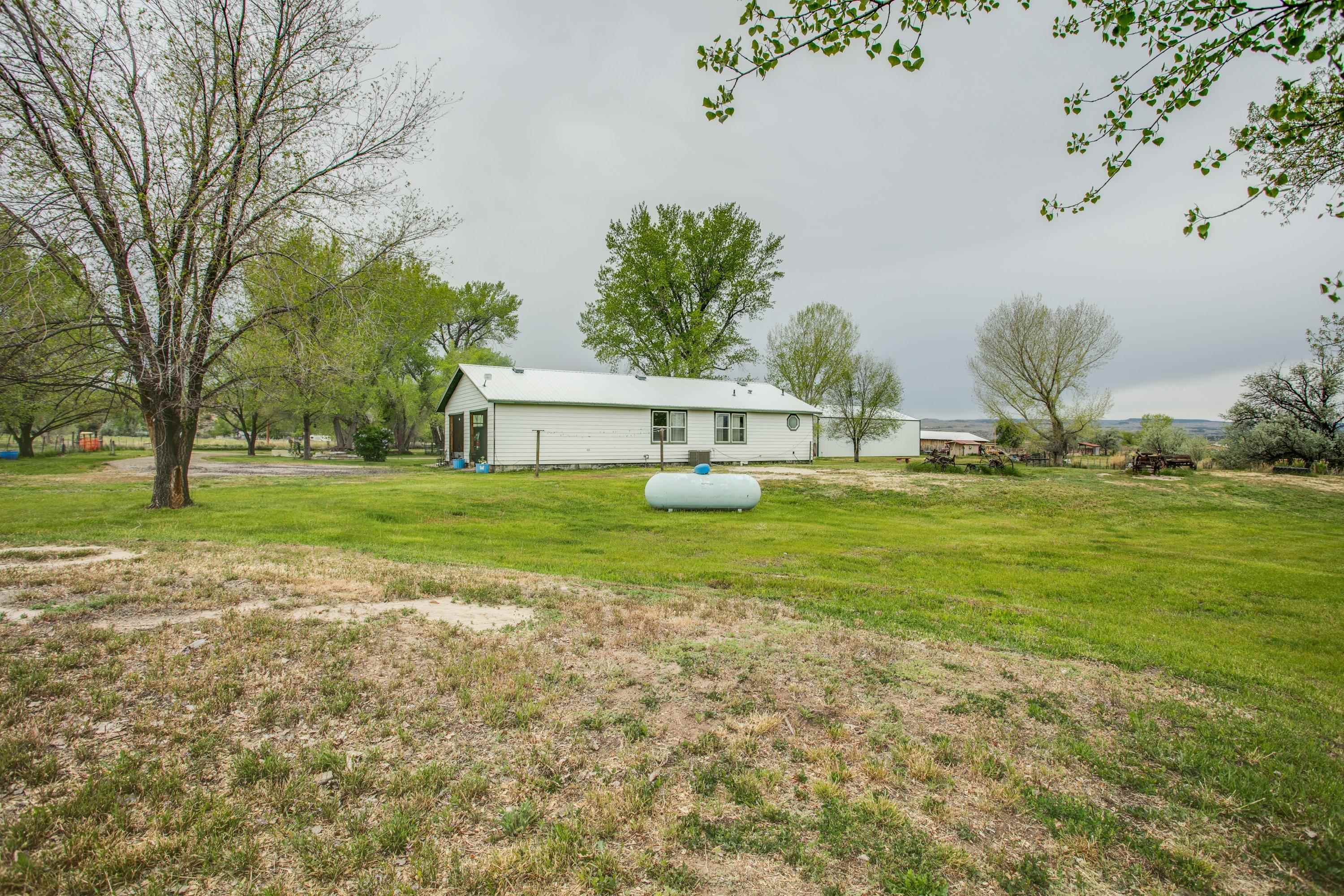 1951 I-70 B Frontage Road De Beque, CO 81630 - Photo 10 of 19 a view of a house with a yard