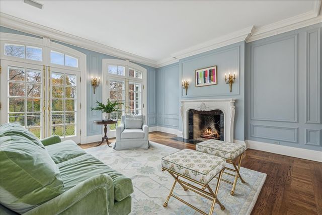a kitchen with a stove a sink and wooden cabinets