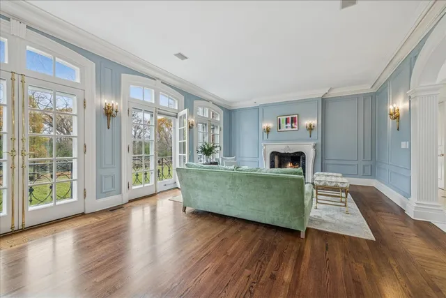 a view of a dining room with furniture wooden floor and chandelier