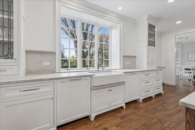 a large spacious bathroom with a granite countertop tub shower and sink