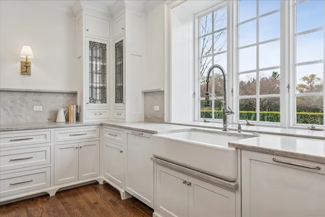 a spacious bathroom with a double vanity sink and a mirror