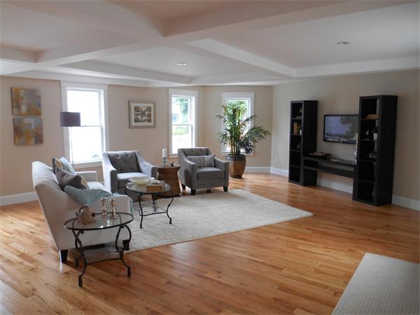 64 Eastern Point Road, Unit 1 Gloucester, MA 01930 - Photo 4 of 30 a living room with furniture and a flat screen tv