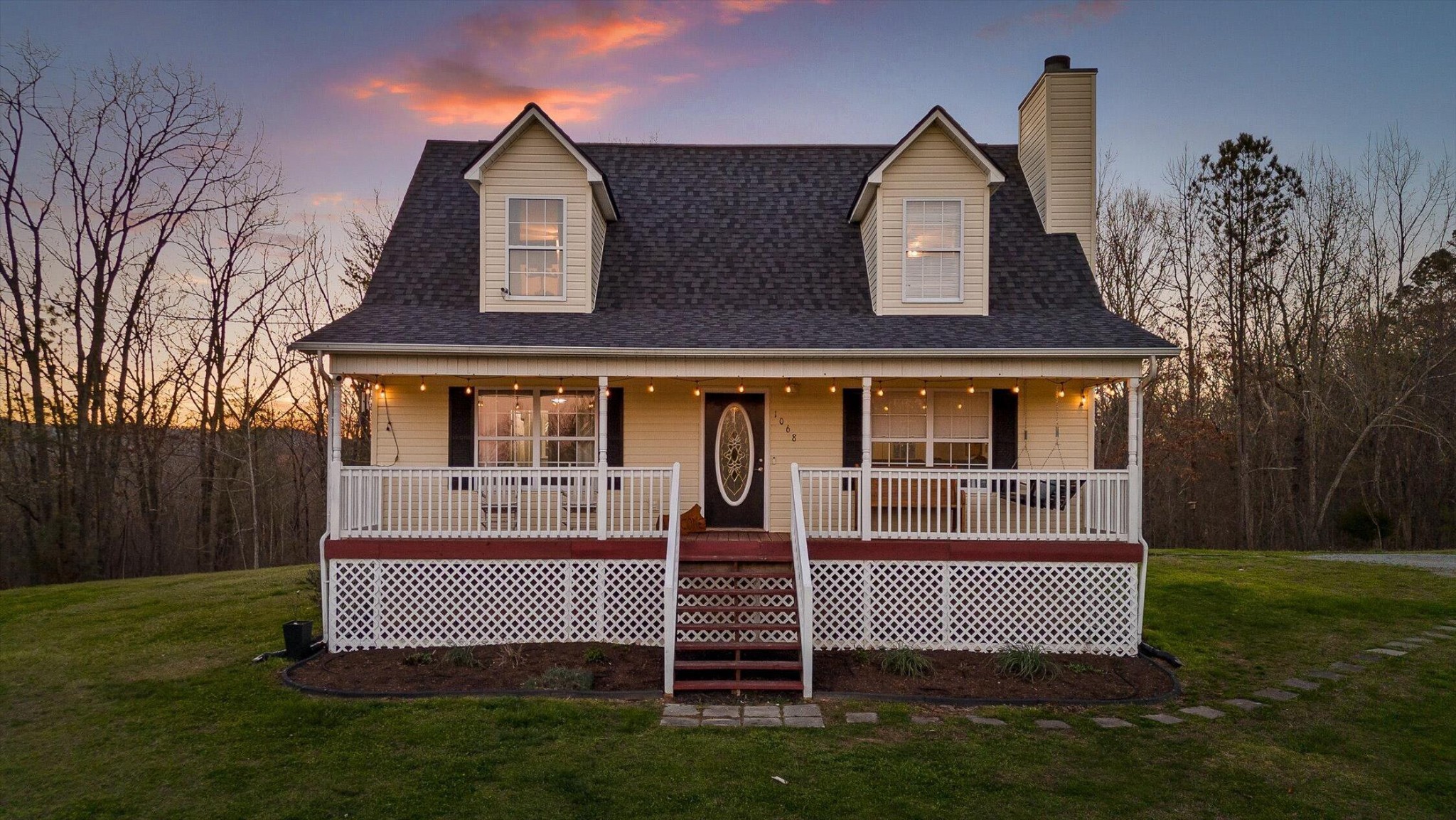 front view of a house with a yard