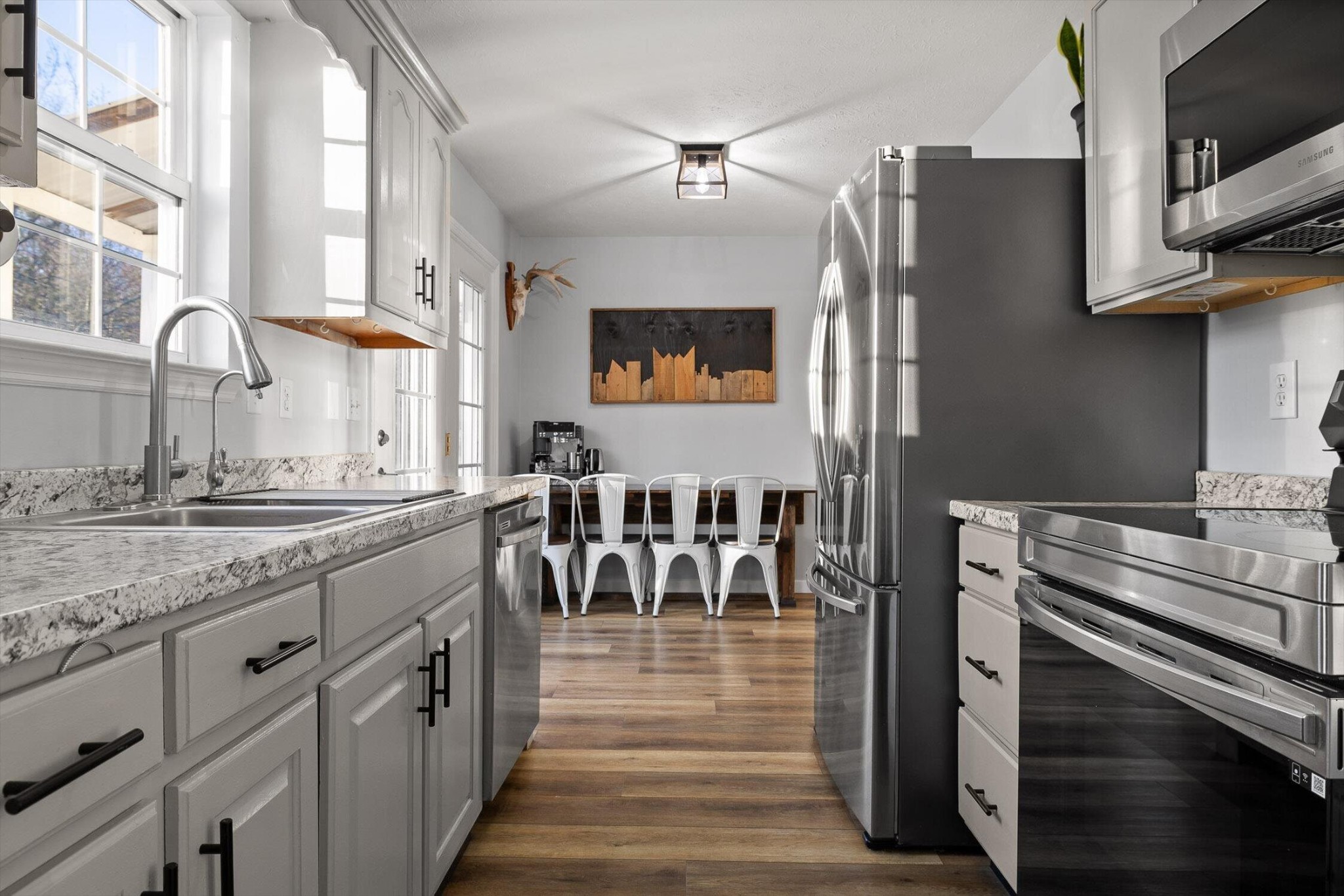 1068 Rogers Road Chickamauga, GA 30707 - Photo 14 of 68 a kitchen with stainless steel appliances granite countertop a stove a sink and a microwave