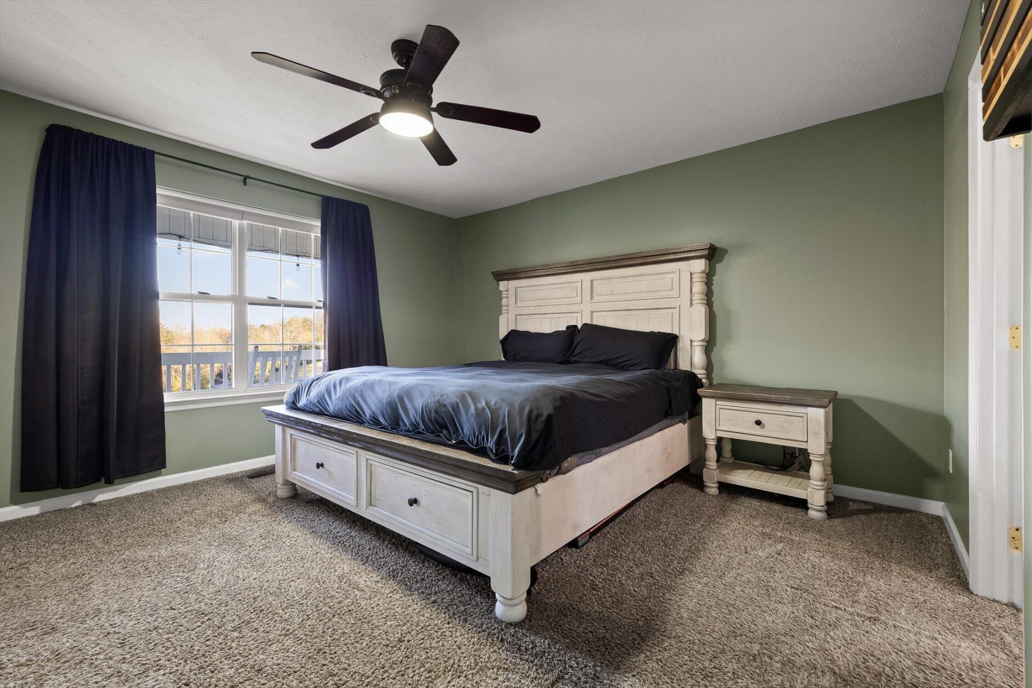 1068 Rogers Road Chickamauga, GA 30707 - Photo 16 of 68 a bedroom with a bed and a ceiling fan
