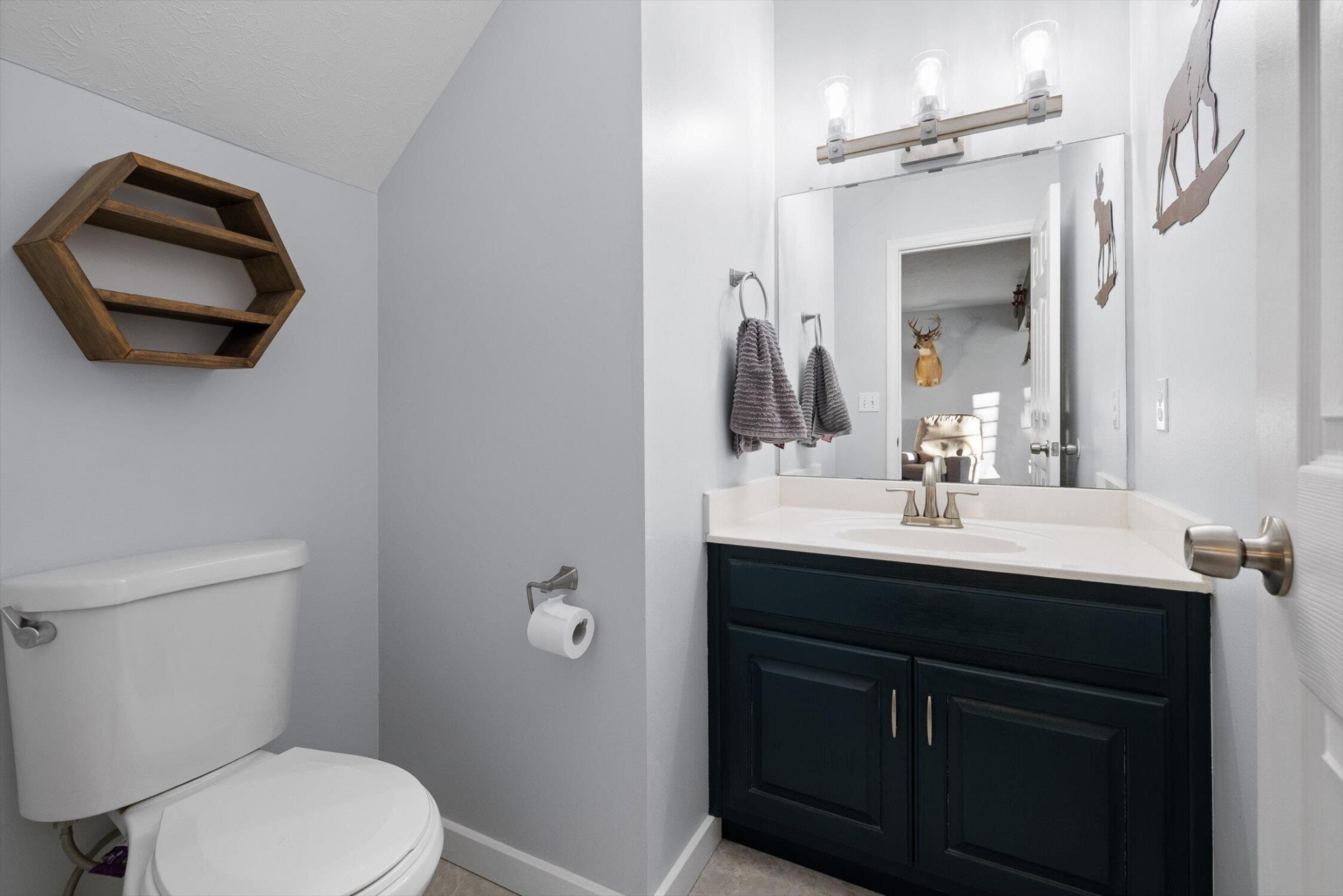 1068 Rogers Road Chickamauga, GA 30707 - Photo 20 of 68 a bathroom with a toilet sink and mirror