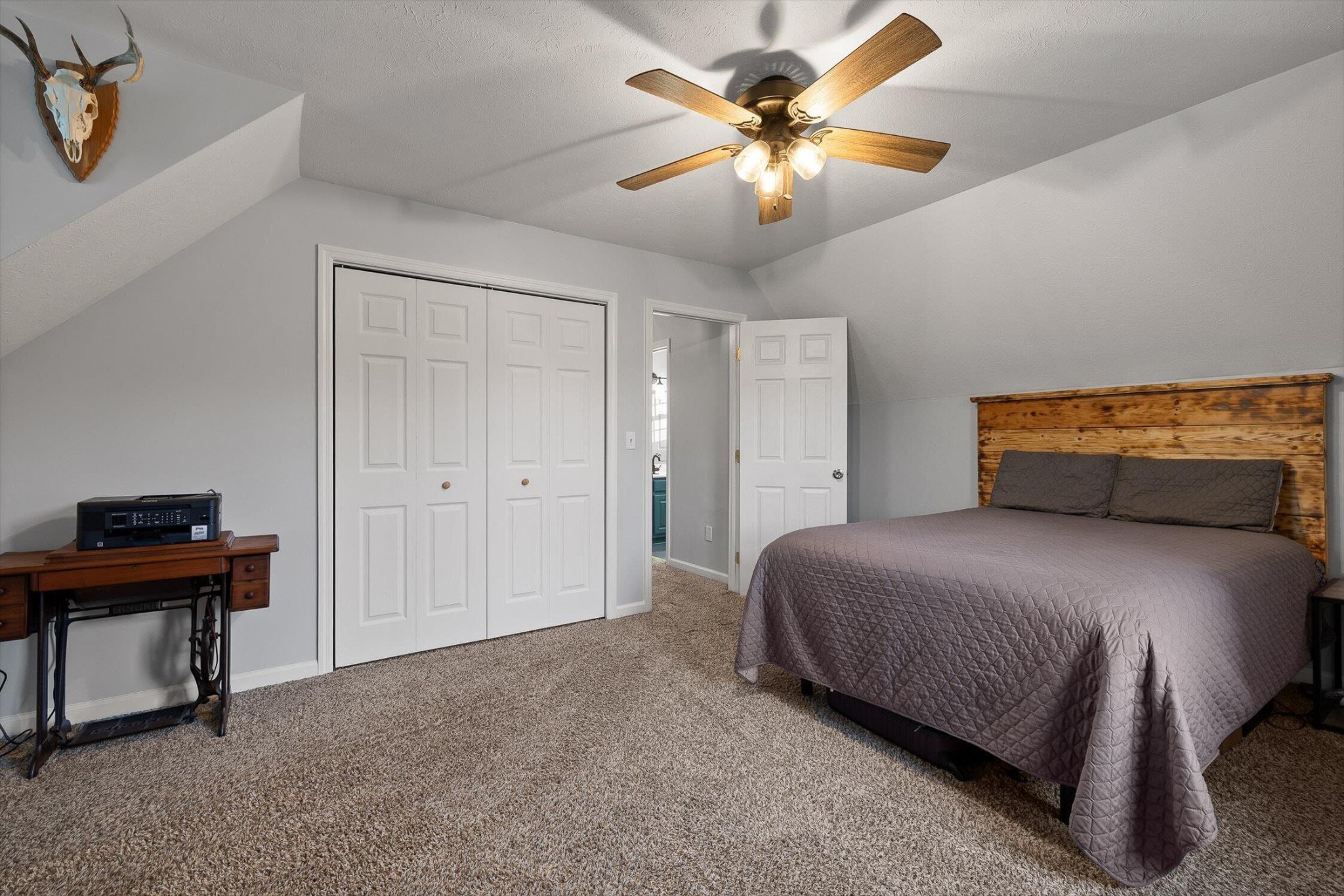 1068 Rogers Road Chickamauga, GA 30707 - Photo 23 of 68 a bedroom with a bed and a chandelier