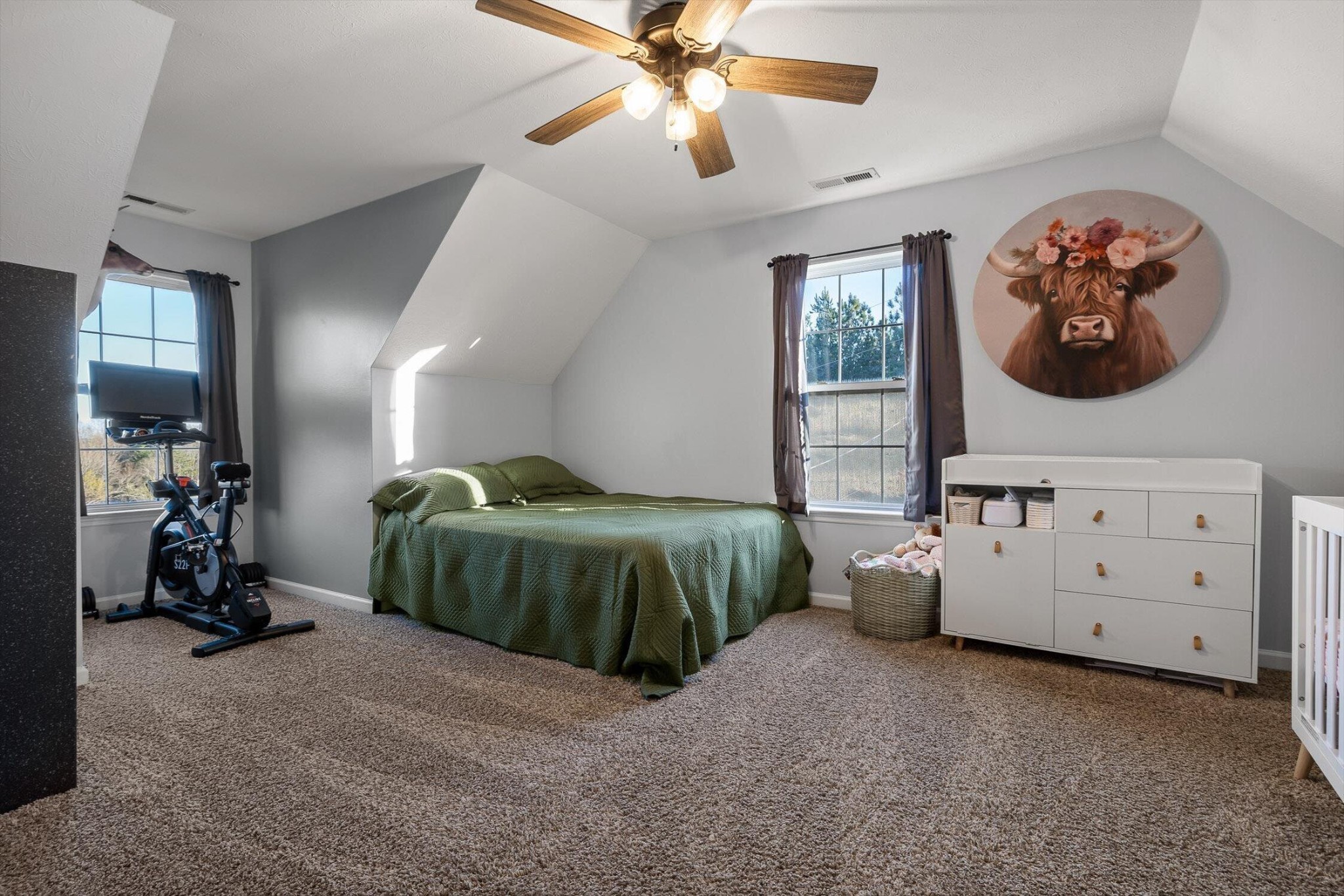 1068 Rogers Road Chickamauga, GA 30707 - Photo 27 of 68 a bedroom with a bed and a chandelier