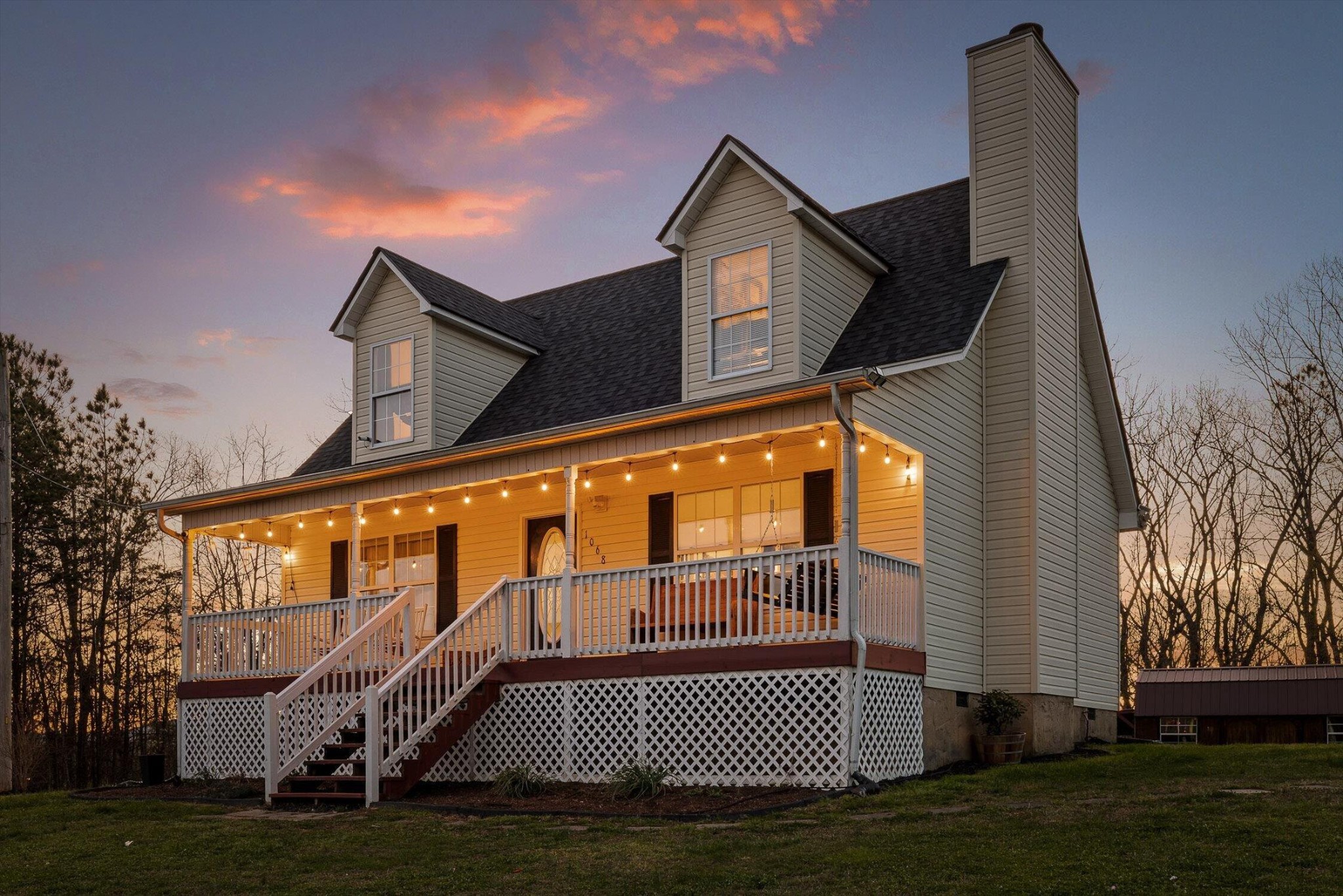 1068 Rogers Road Chickamauga, GA 30707 - Photo 30 of 68 a front view of a house with a garden