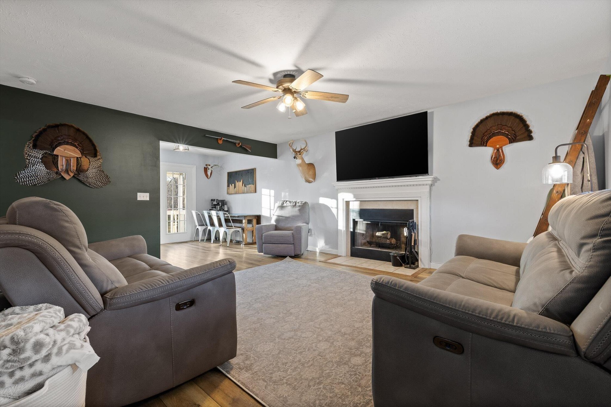 1068 Rogers Road Chickamauga, GA 30707 - Photo 3 of 68 a living room with furniture a fireplace and a flat screen tv