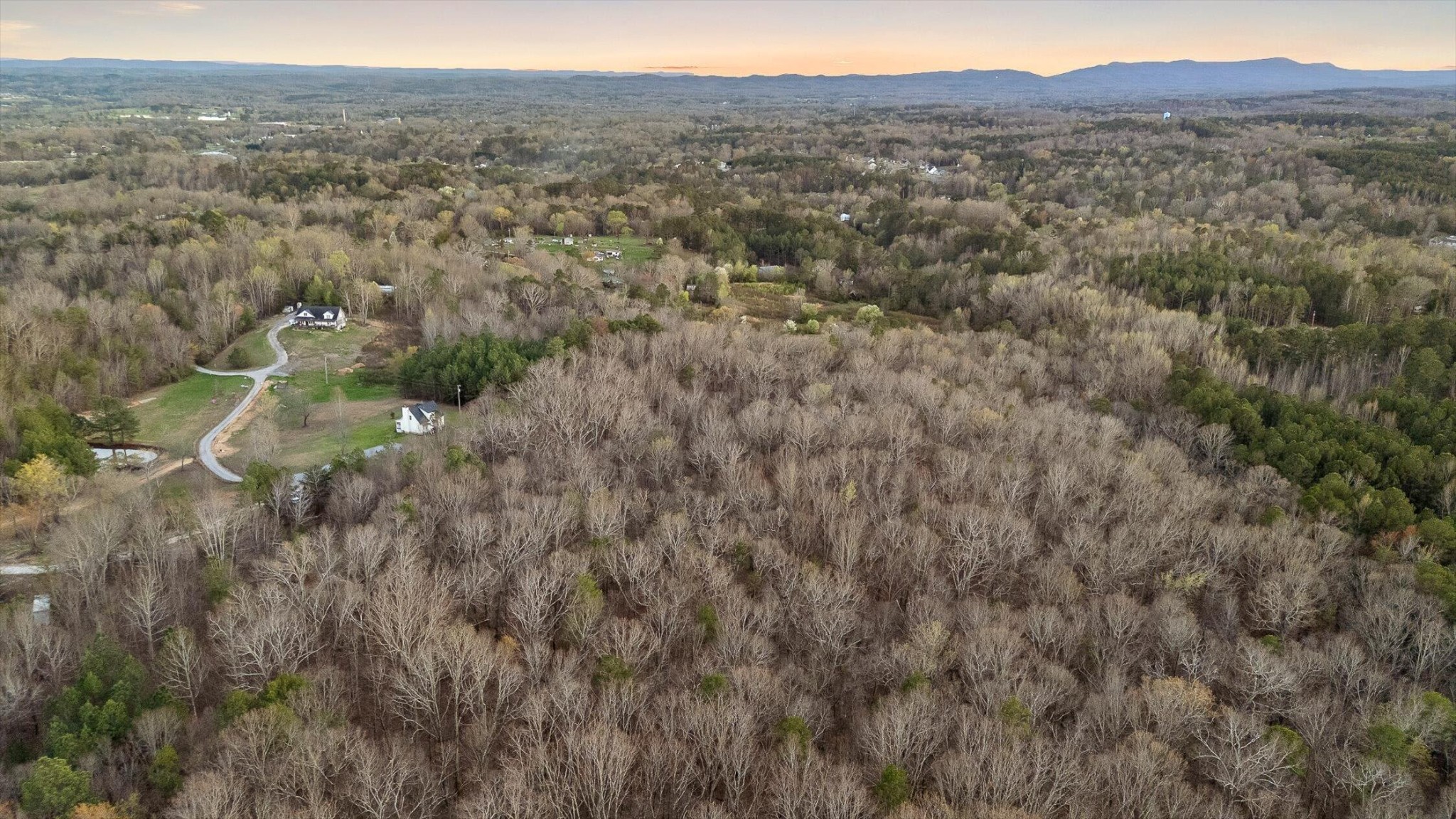 1068 Rogers Road Chickamauga, GA 30707 - Photo 50 of 68 a view of a city with lush green forest