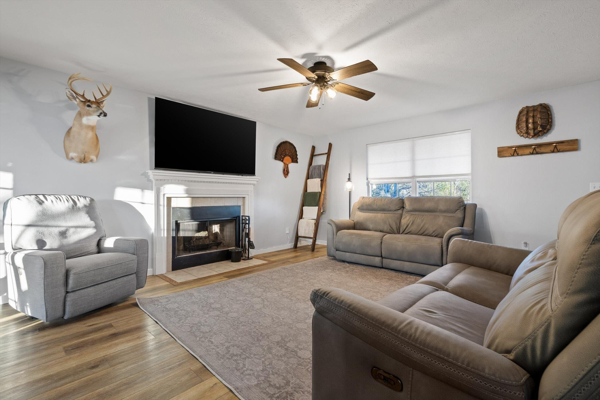 1068 Rogers Road Chickamauga, GA 30707 - Photo 6 of 68 a living room with furniture a flat screen tv and a fireplace