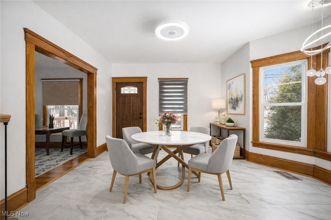 33895 Lorain Road North Ridgeville, OH 44039 - Photo 4 of 24 Dining area featuring plenty of natural light and light marble finish floors
