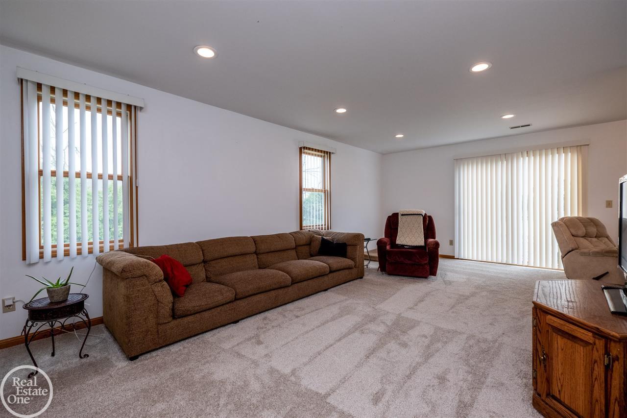 5425 Kidder Road Almont, MI 48003 - Photo 16 of 47 Living room has access to the deck that overlooks the property!