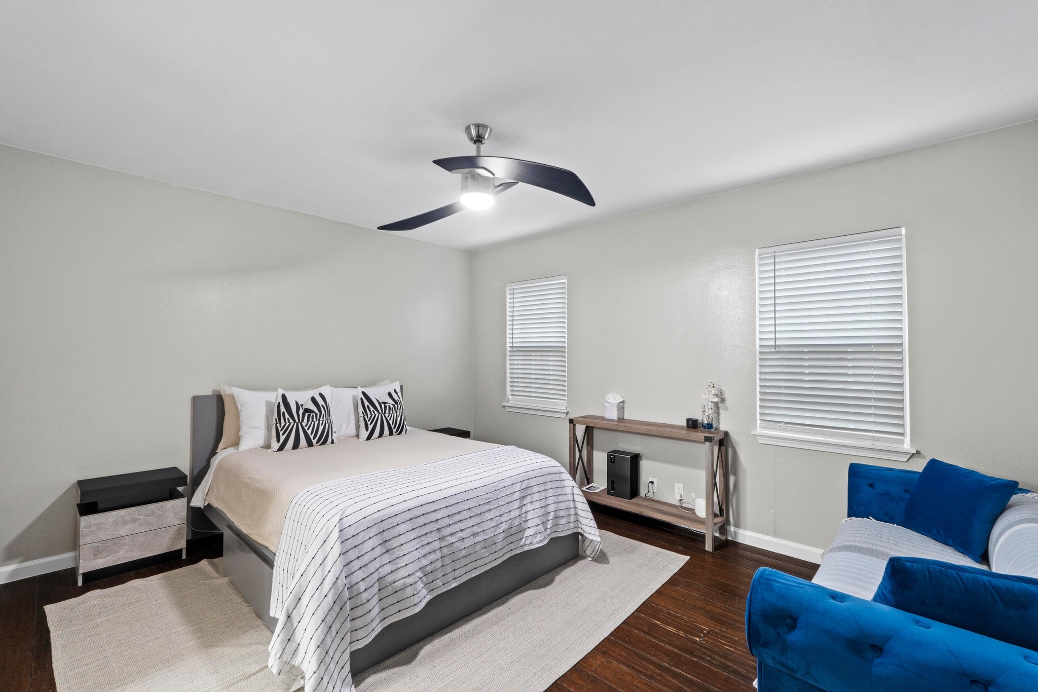 4512 Speedway, Unit A Austin, TX 78751 - Photo 28 of 39 a bedroom with a bed couch and window