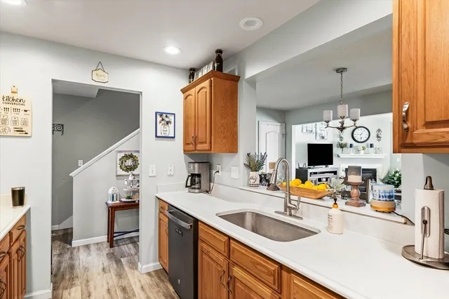a kitchen with a sink appliances and cabinets