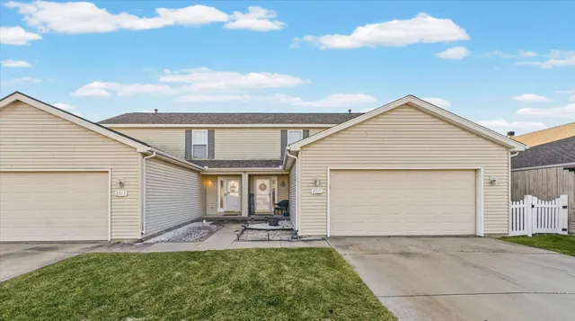 a view of backyard of house and garden